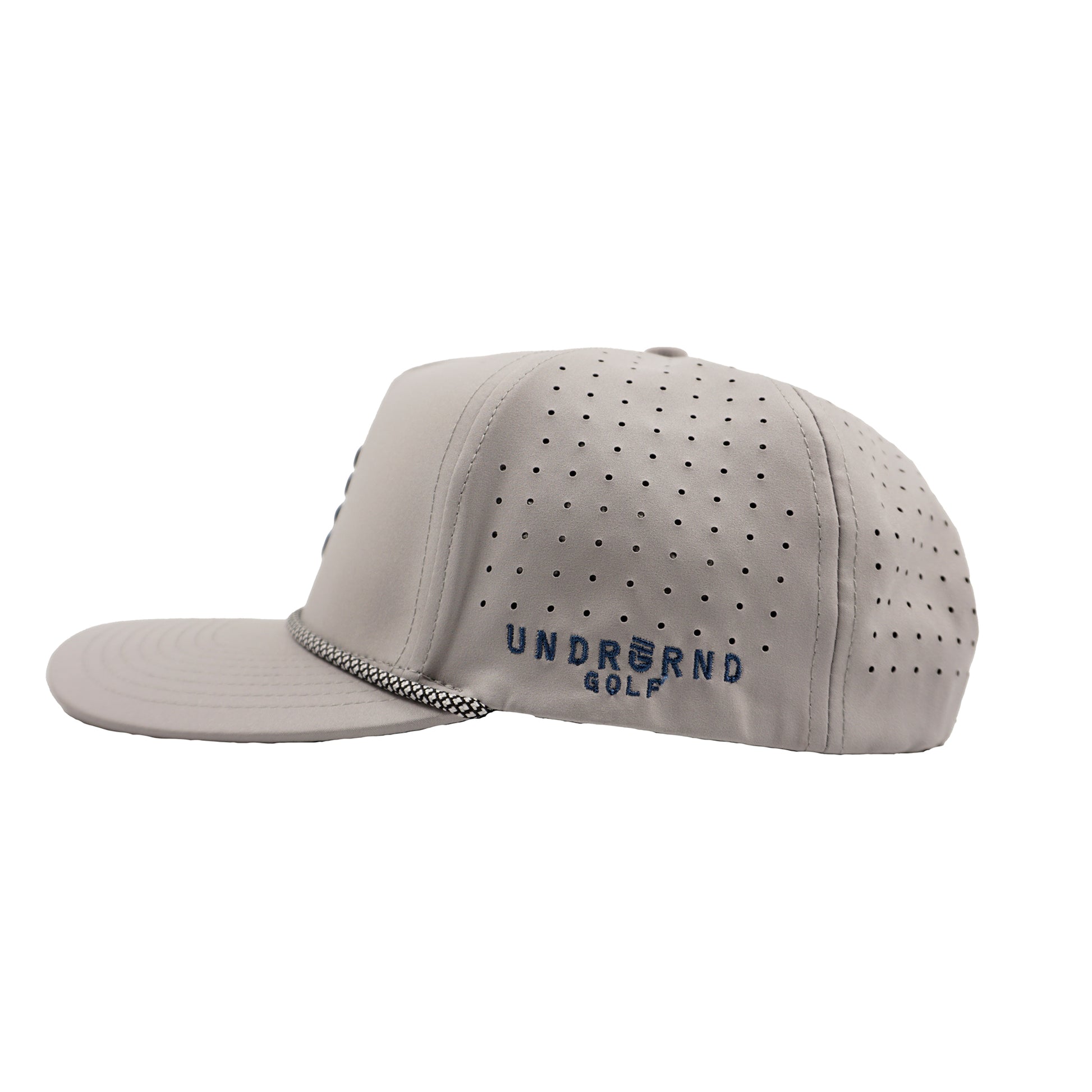 Side profile of a gray perforated golf hat with UNDRGRND GOLF embroidered on the left in blue. 